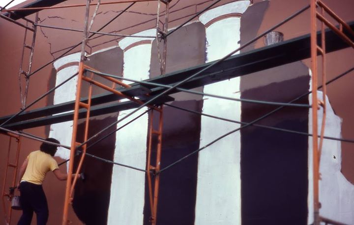 Pugh painting the mural in 1981.
