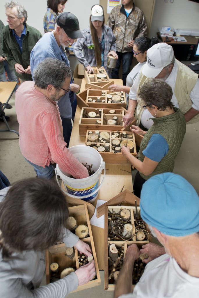 More than 60 people crowded a classroom at University Farm for a workshop on building bee hotels.
