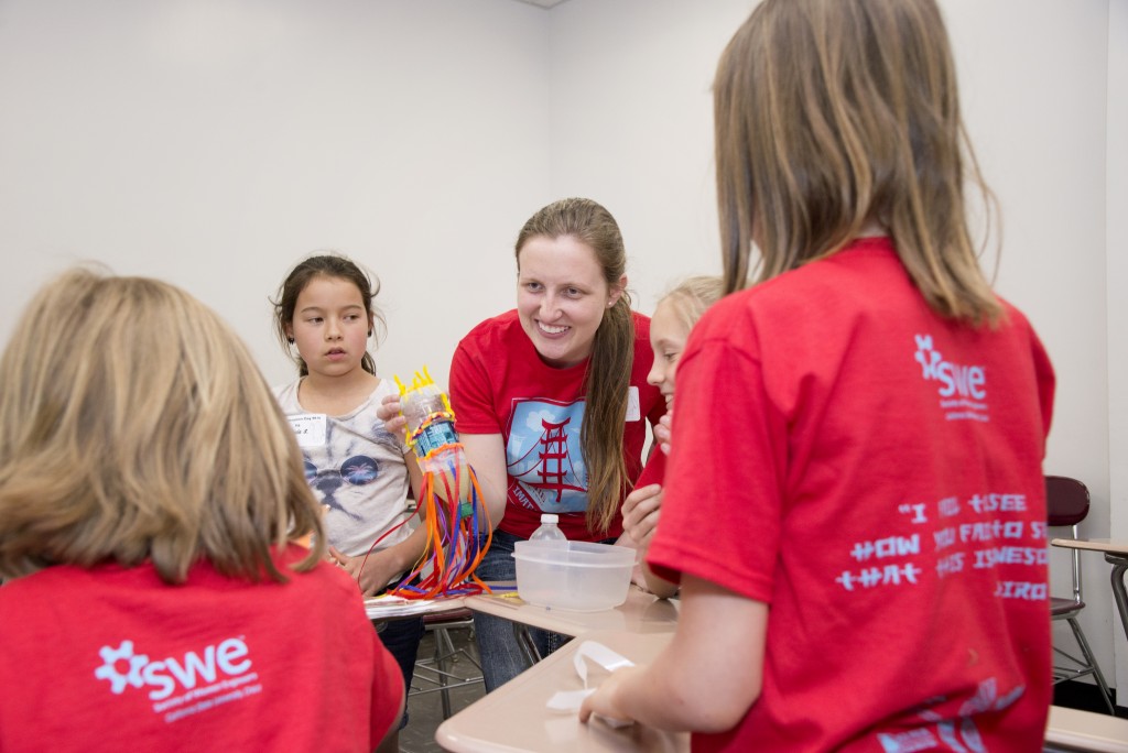 Kylee Davis is shown interacting with young girls at SWE's most recent Imagineer Day. (Photo Courtesy of Jessica Bartlett, Student Photographer)