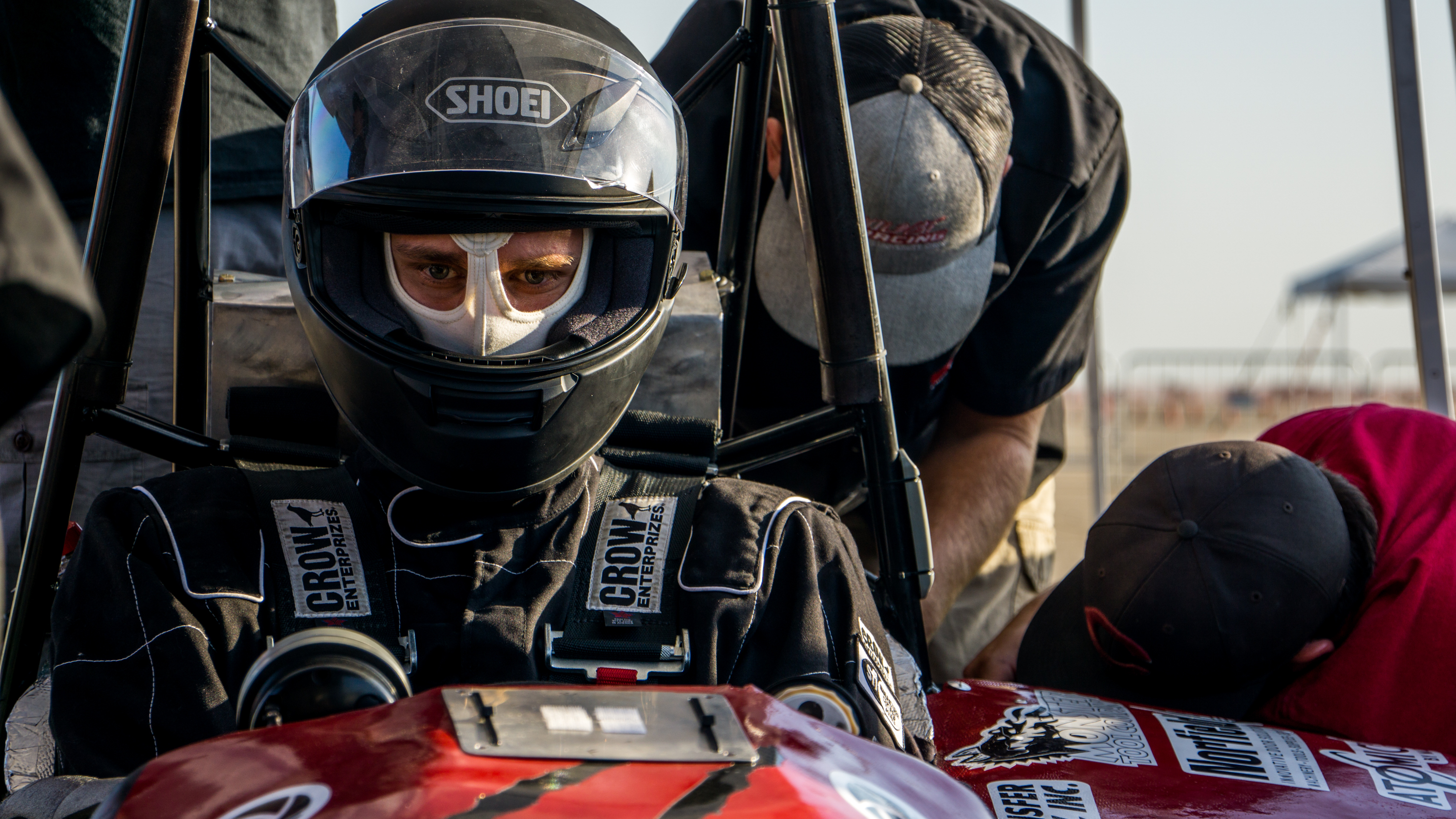 Chico State student Spencer Johnson sits in the team's car waiting for the endurance race at the SAE Formula international competition.