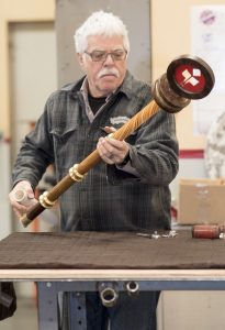 Jeff Lindsay at Red Hot Metal assembles the new mace just in time for President Hutchinson's inauguration.