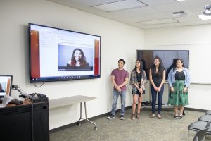 Students (from left to right) Christopher Barbosa, Breanna Barnard, Elizabeth Castillo, and Bianca Quilantan present their Listen to Change interviews in the Meriam Library. <br /> (Jessica Bartlett / Student Photographer)