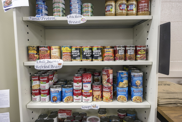Several shelves of canned and jarred foods are displayed at the Hungry Wildcat Food Pantry.