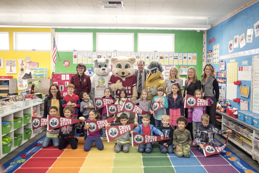 Kindergartner class poses with education officials and mascots from Butte College and Chico State