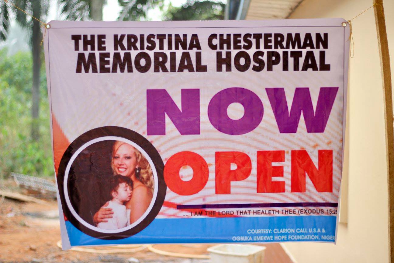A sign advertising the clinic is open hangs on a window.