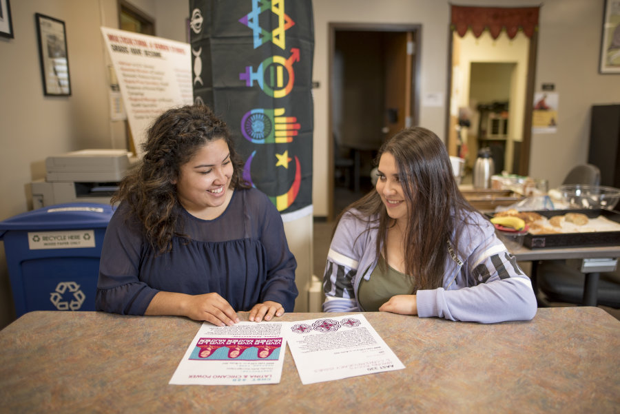 Outstanding Senior Unique Torres (left) is photographed while working with her friend Roxanna Necoechea (right) in the Center for Multicultural and Gender Studies on Thursday, April 12, 2018 in Chico, Calif.  (Jessica Bartlett /University Photographer/CSU Chico)