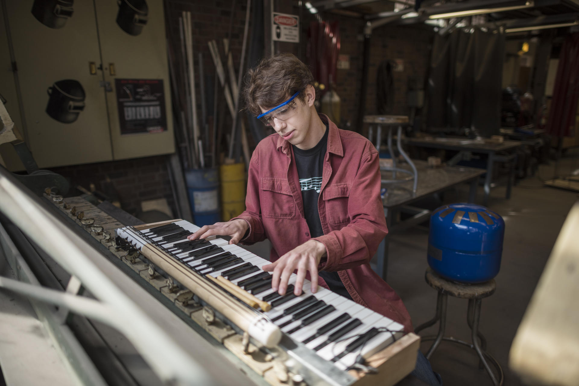 Daniel Michelson works on his DIY musical instrument creations in the Ayres Art Shop.