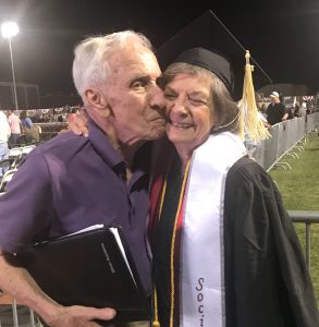 Wally Hamilton kisses Sylvia on the cheek at her graduation.