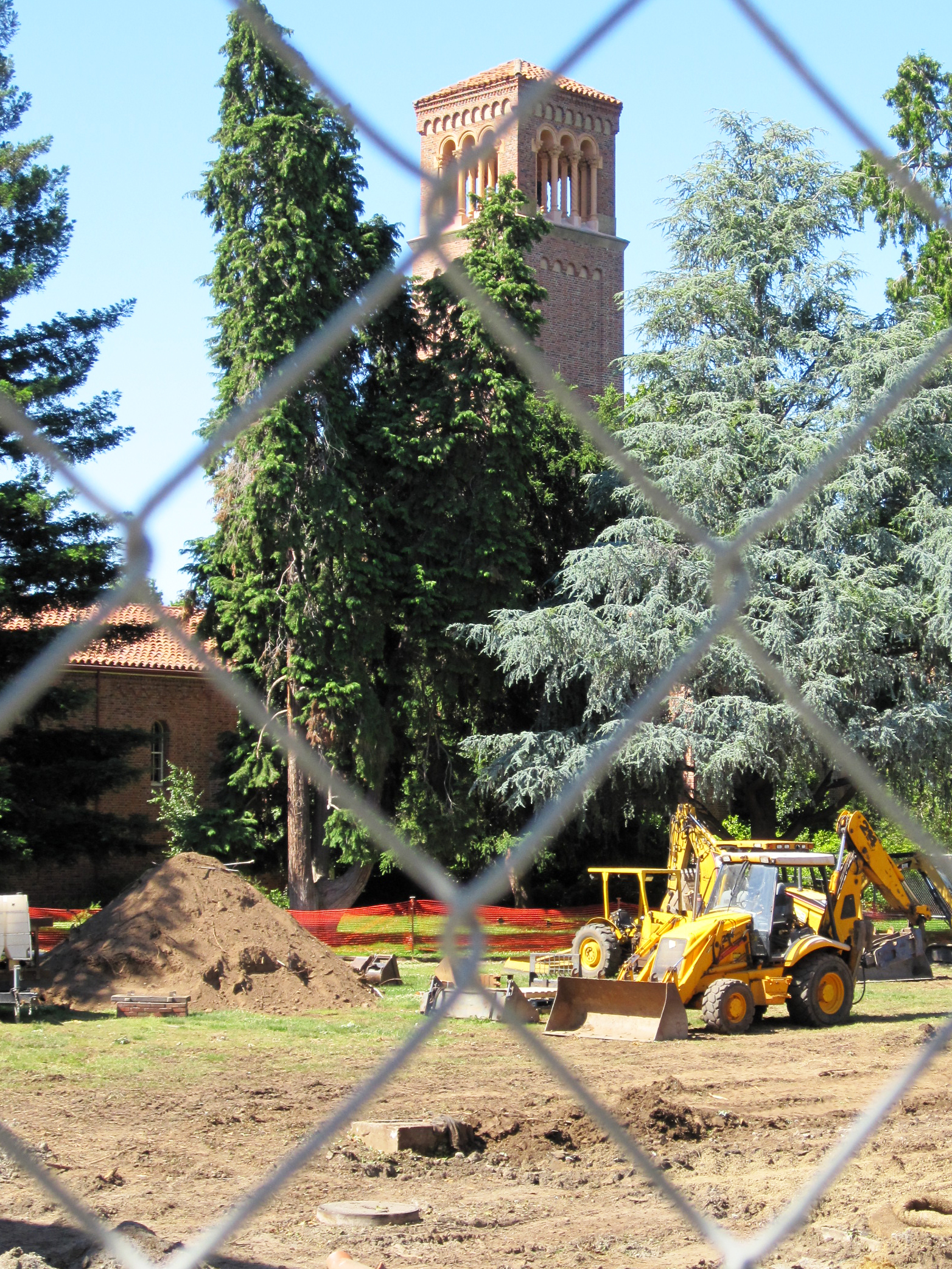 A bulldozer clears area on Trinity Commons