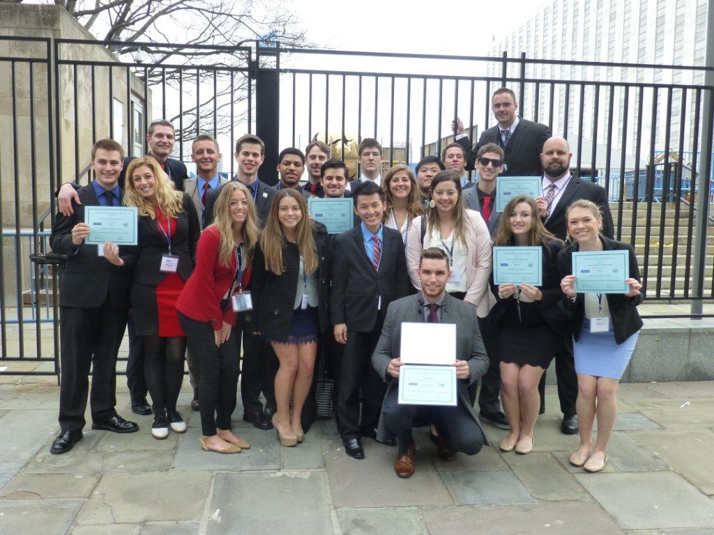 Model UN team poses with their winning certificates