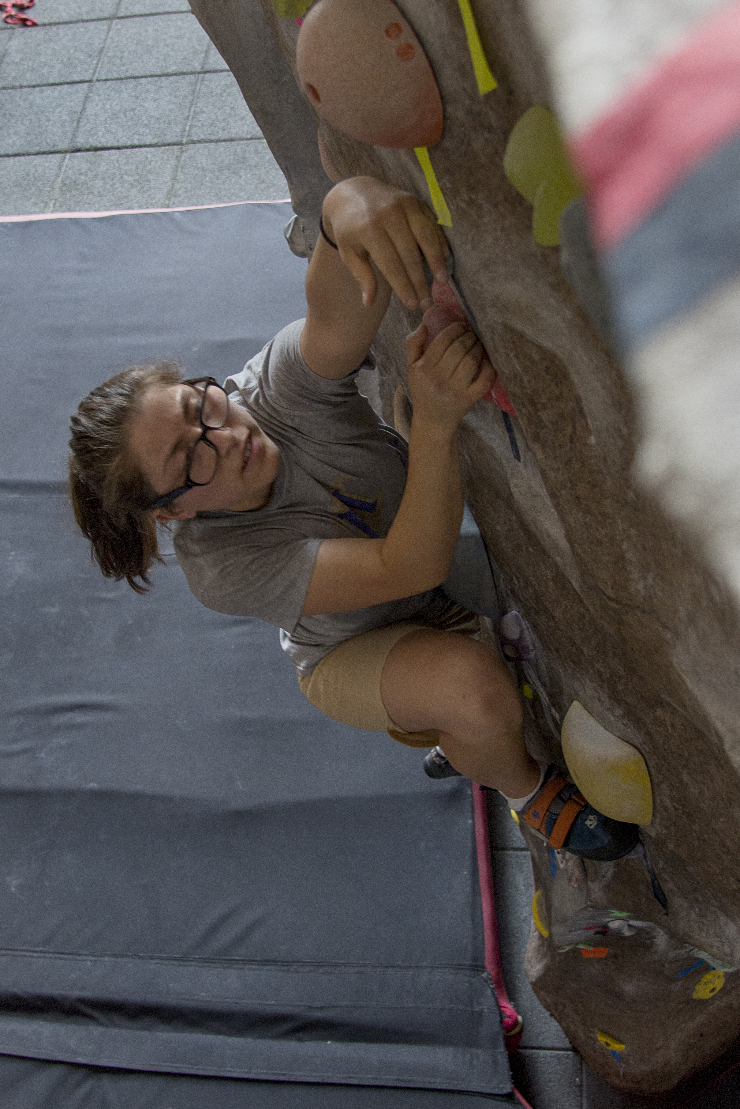 Student climbs the climbing wall at the WREC