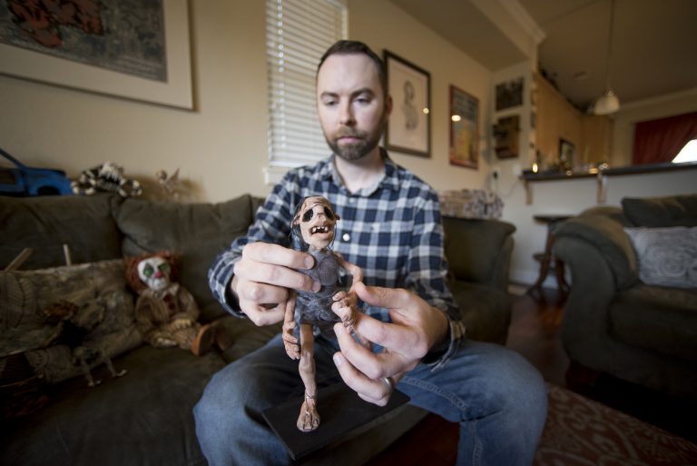 Josh Funk displays one of the models used in his short film, 3 Keys, at his home in Chico.