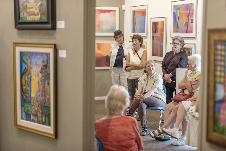 Professor Emeritus Dolores Mitchell (center) leads an Arts and Eats Class class for fellow OLLI members at the Chico Art Center