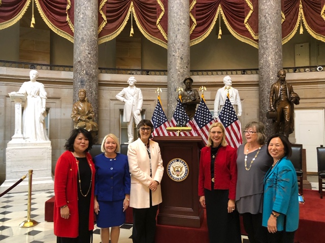 President Hutchinson and other women CSU presidents stand in the National Statuary Hall at the Capitol.