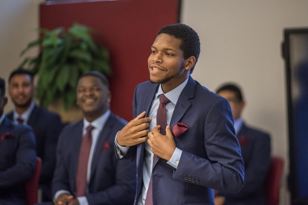 Kimani Davis II and other students are honored during program graduation of the first cohort of Men of Color