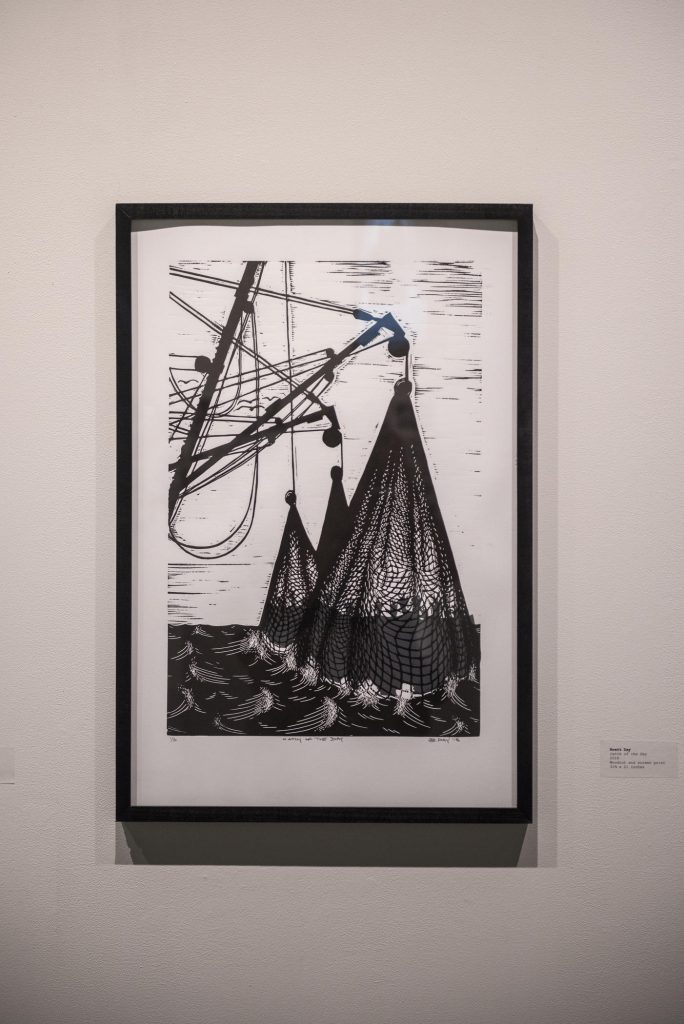 A screen print depicting fishing nets in the ocean.