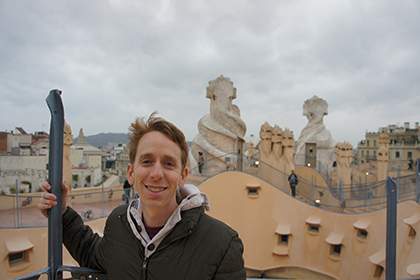 Matthew Stone standing with a view of Barcelona behind him.