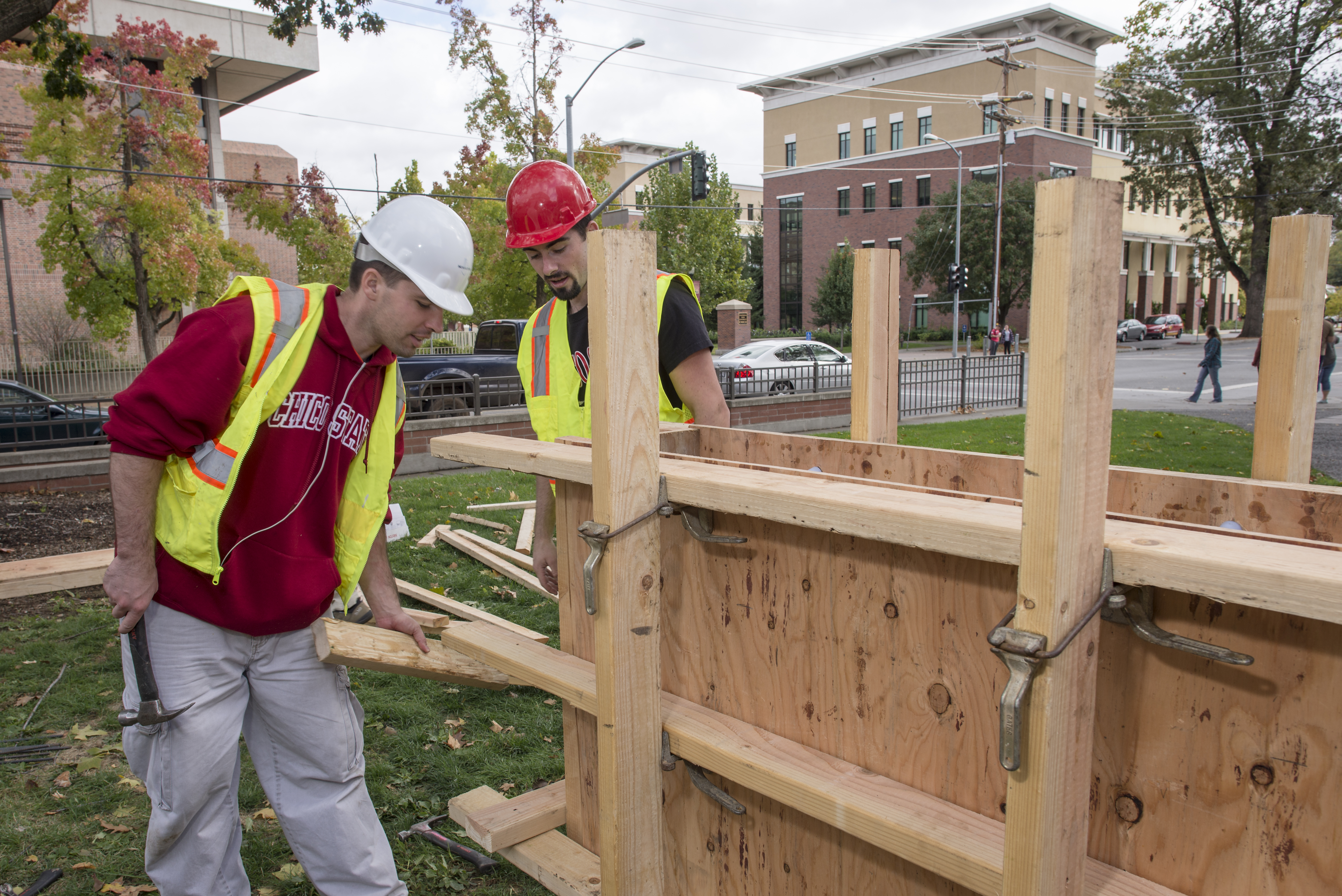 Grant Morgan (left) and Matt Hall (right) build concrete forms as part of a competition that was timed and measured for quality during a demonstration for more than 1,500 prospective students and their families visit the campus and engage directly with faculty, staff and current students at the 20th annual Chico Preview Day Saturday, October 25, 2014 in Chico, Calif. (Jason Halley/University Photographer)