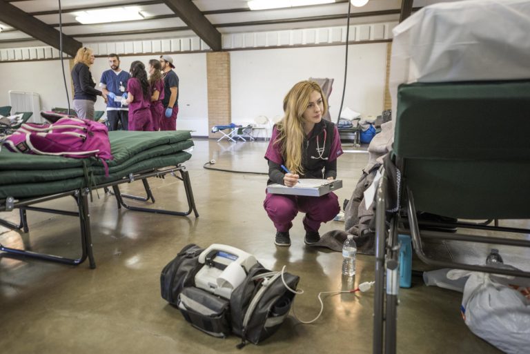 School of Nursing student Shannon Watson assists with patient care and health needs for evacuees of the Oroville Dam Spillway Incident at the Evacuation Center at the Silver Dollar Fairgrounds.