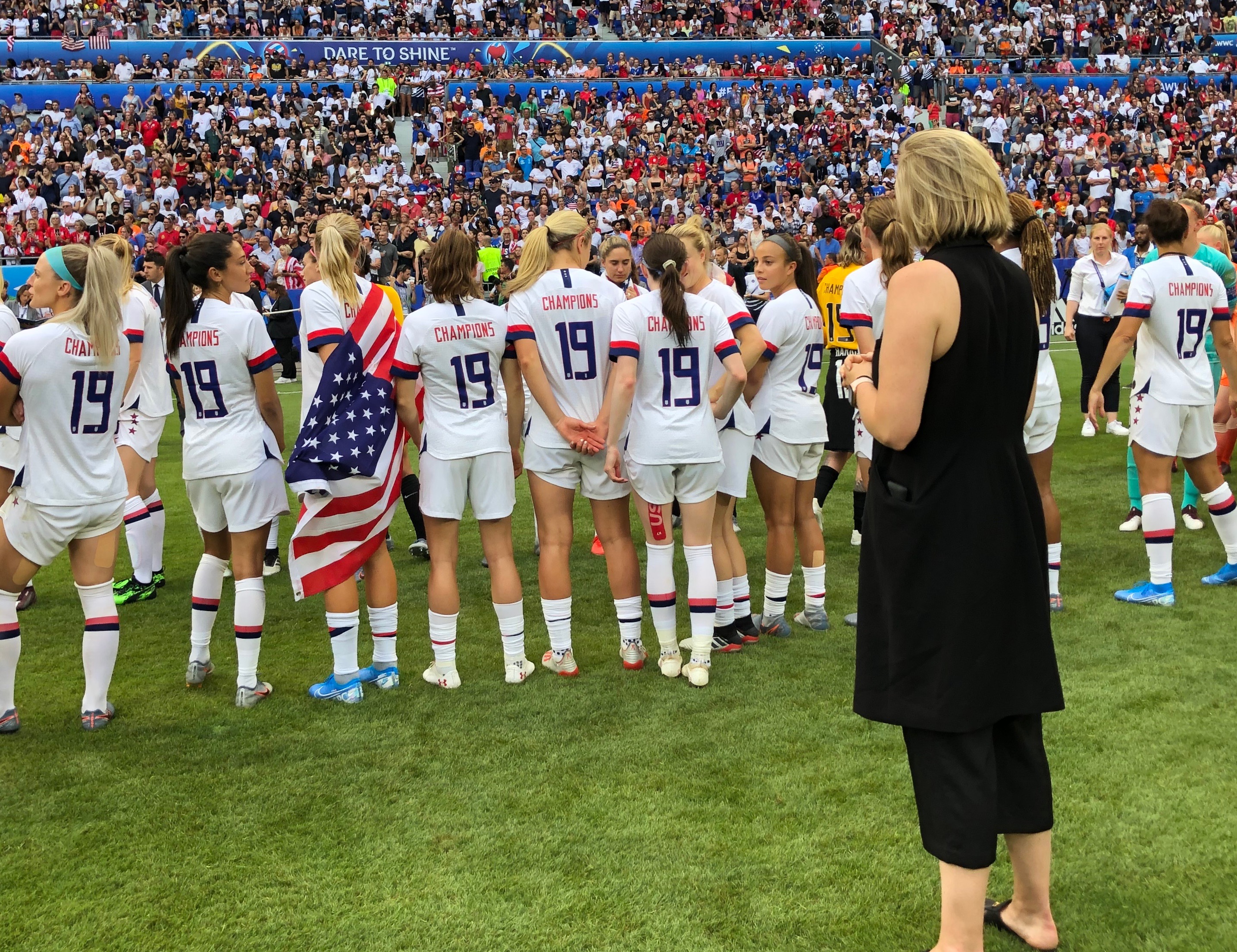 Molly Downtain stands on the field during the Wold Cup celebration.