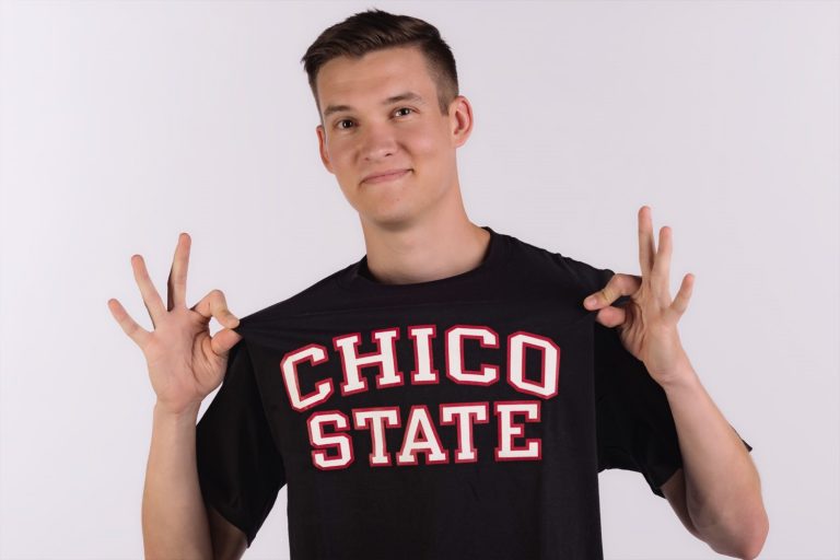 Student shows off his Chico State t-shirt.