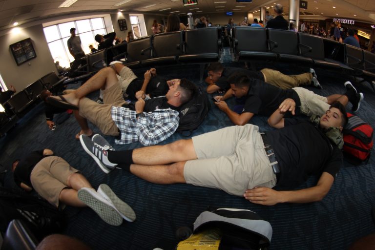 Members of the Chico State men's soccer team relax during a layover at Hartsfield-Jackson Atlanta International Airport, on their way to Spain. (Photo by Dylan Wakefield/Men's Soccer)