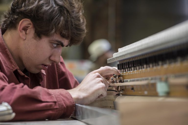 Daniel Michelson, is an HFA outstanding student leader award winner, and a double major in music and engineering, works on his DIY musical instrument creations in the Ayres Art Shop.