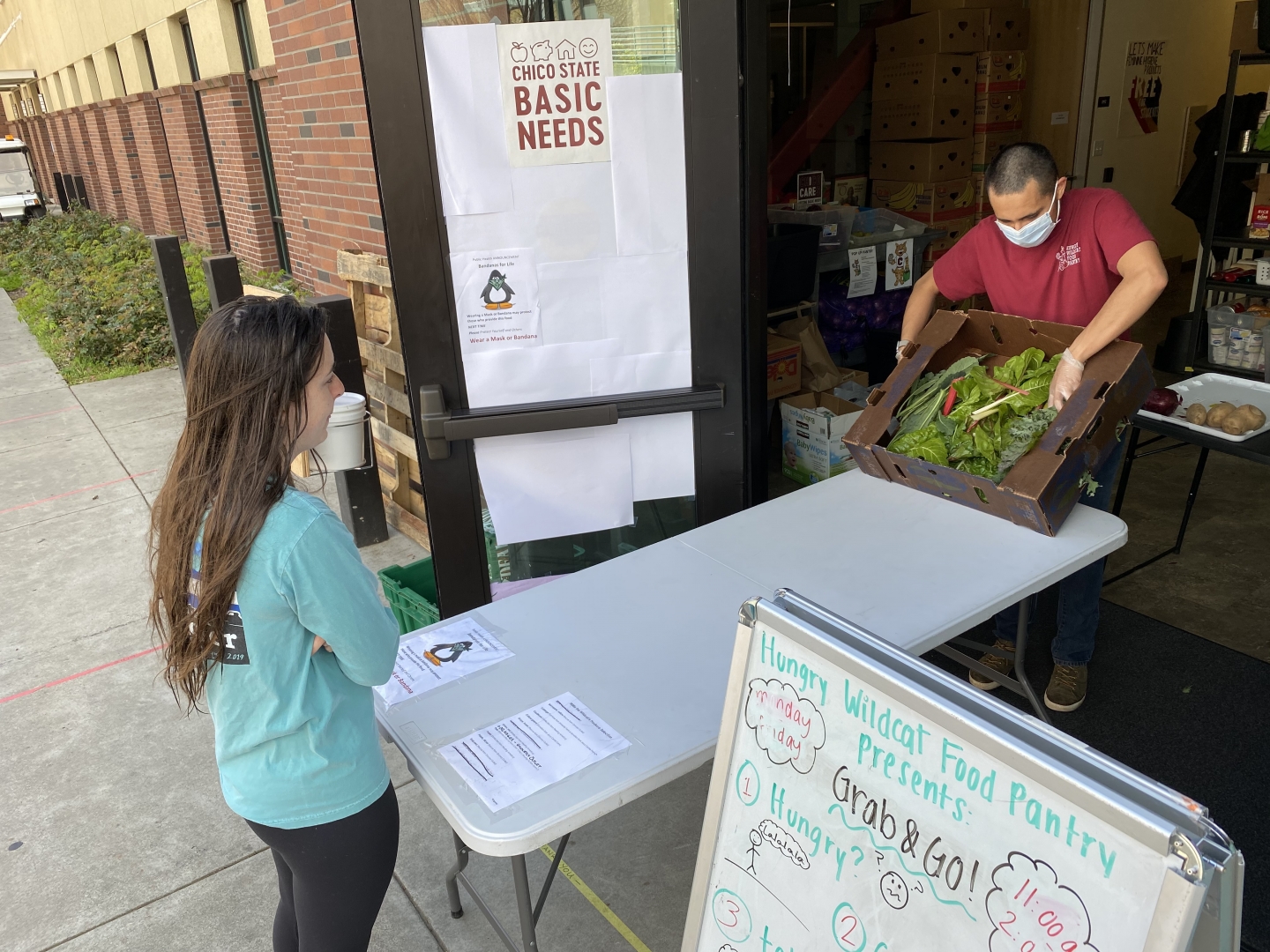 A student looks at options of fresh vegetables.