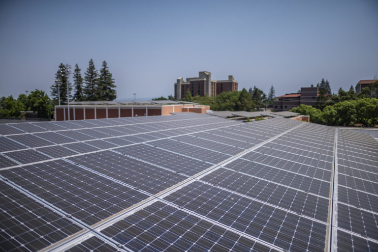 Solar panels are arrayed atop of Yolo Hall (in front) and Acker Gym (center) with Whitney Hall in the background on the Chico State campus. Chico State was recently recognized for an overall commitment to sustainable practices in the Association for the Advancement of Sustainability in Higher Education's its 2018 Sustainability Campus Index. Additionally, Sierra Club placed CSU, Chico at No. 9 in its “Cool Schools 2018” list, the highest ranking of any CSU institution, and the first top-10 overall sustainability ranking nationwide for the University.