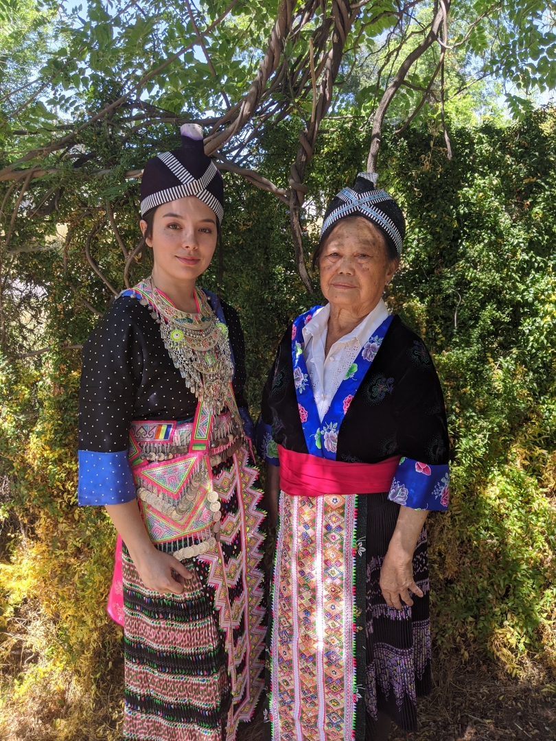 Jasmine Vang poses with her grandmother in traditional Hmong dress.
