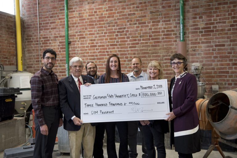 Faculty and staff from Chico State's Concrete Industry Management Program and University President Gayle Hutchinson welcome donor Doug Guerrero as he donates $300,000 to help renovate a concrete lab.