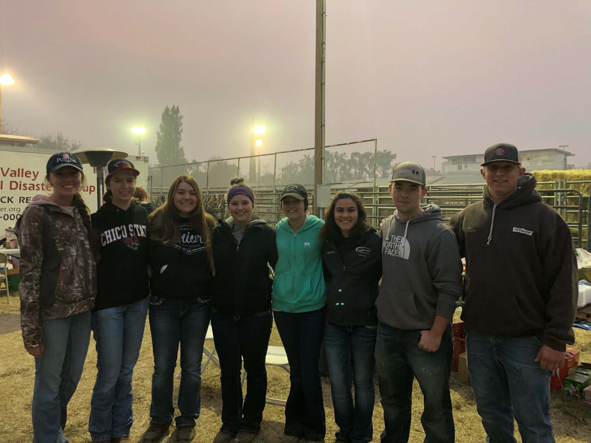 Livestock judging Team members stand in the smoky haze at the Butte County Fairgrounds.