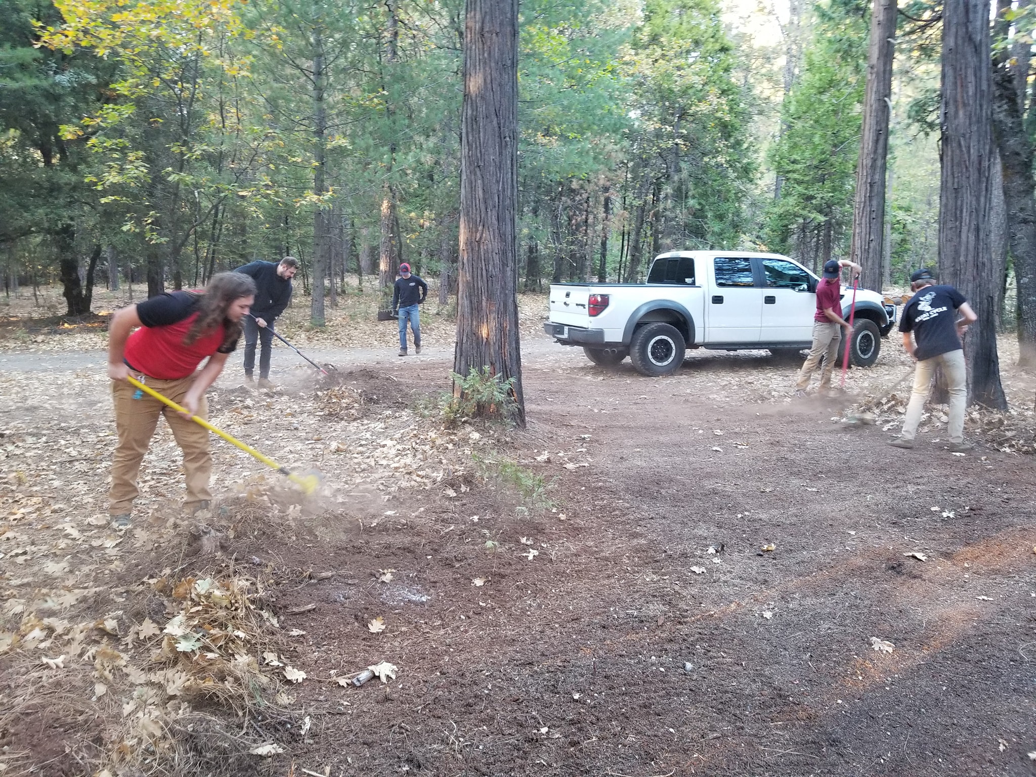 Chico State Cycling Team working to clear Brian Kavenaugh’s fire break to mitigate against the Camp Fire.