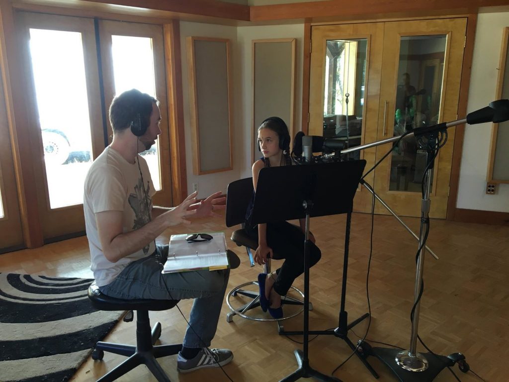 Josh Funk works with Mila Purvis on voice recording.