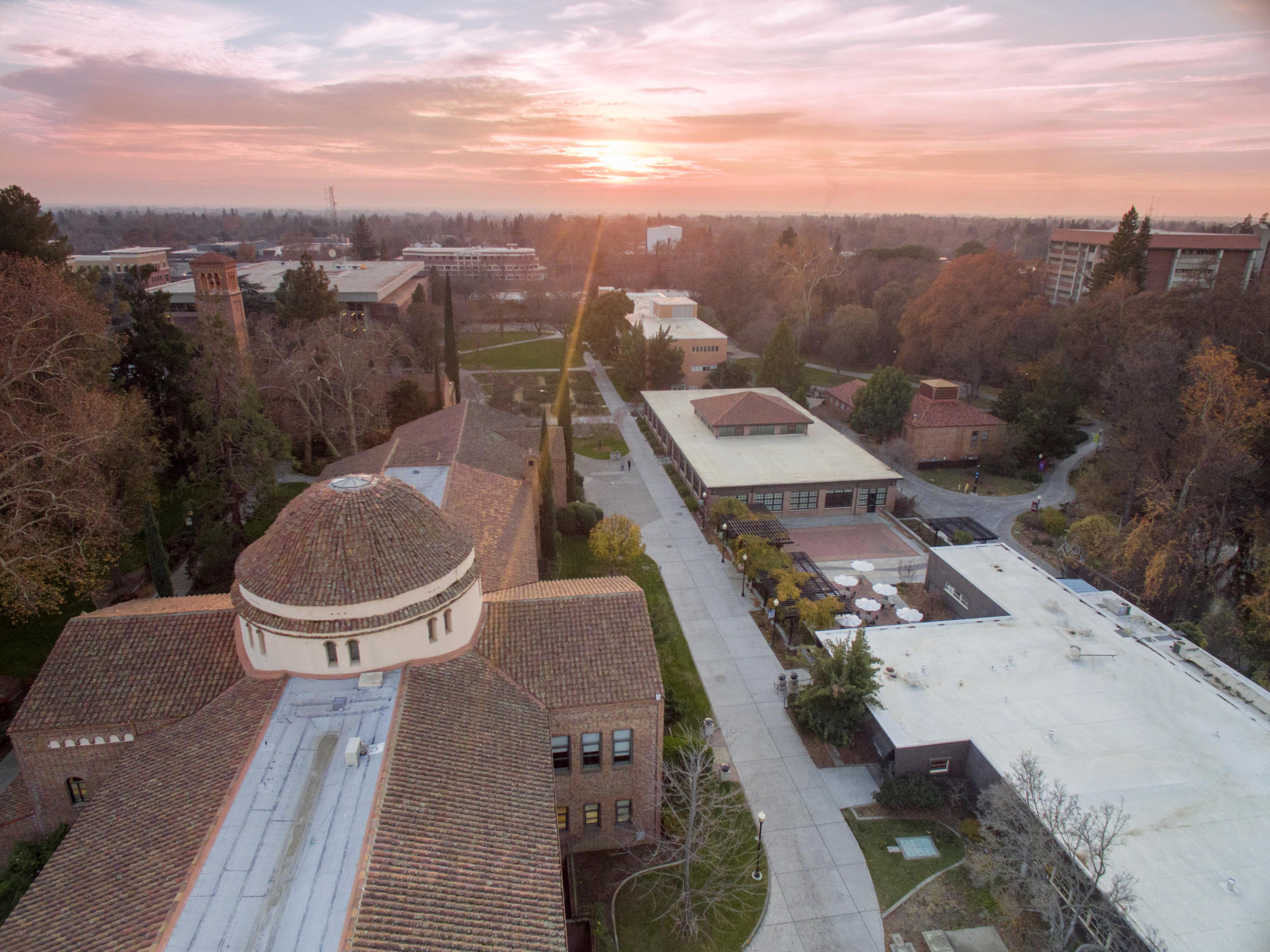 The sun sets over the Chico State campus on a winter afternoon.