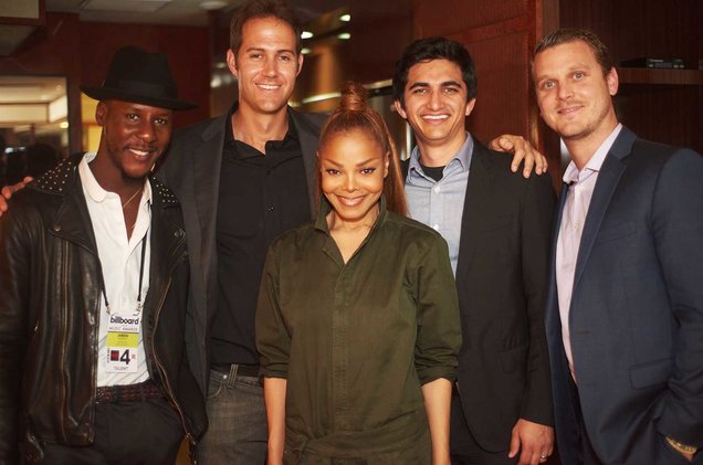 Janet Jackson and Barry Daffurn pose for a photo with three other men.