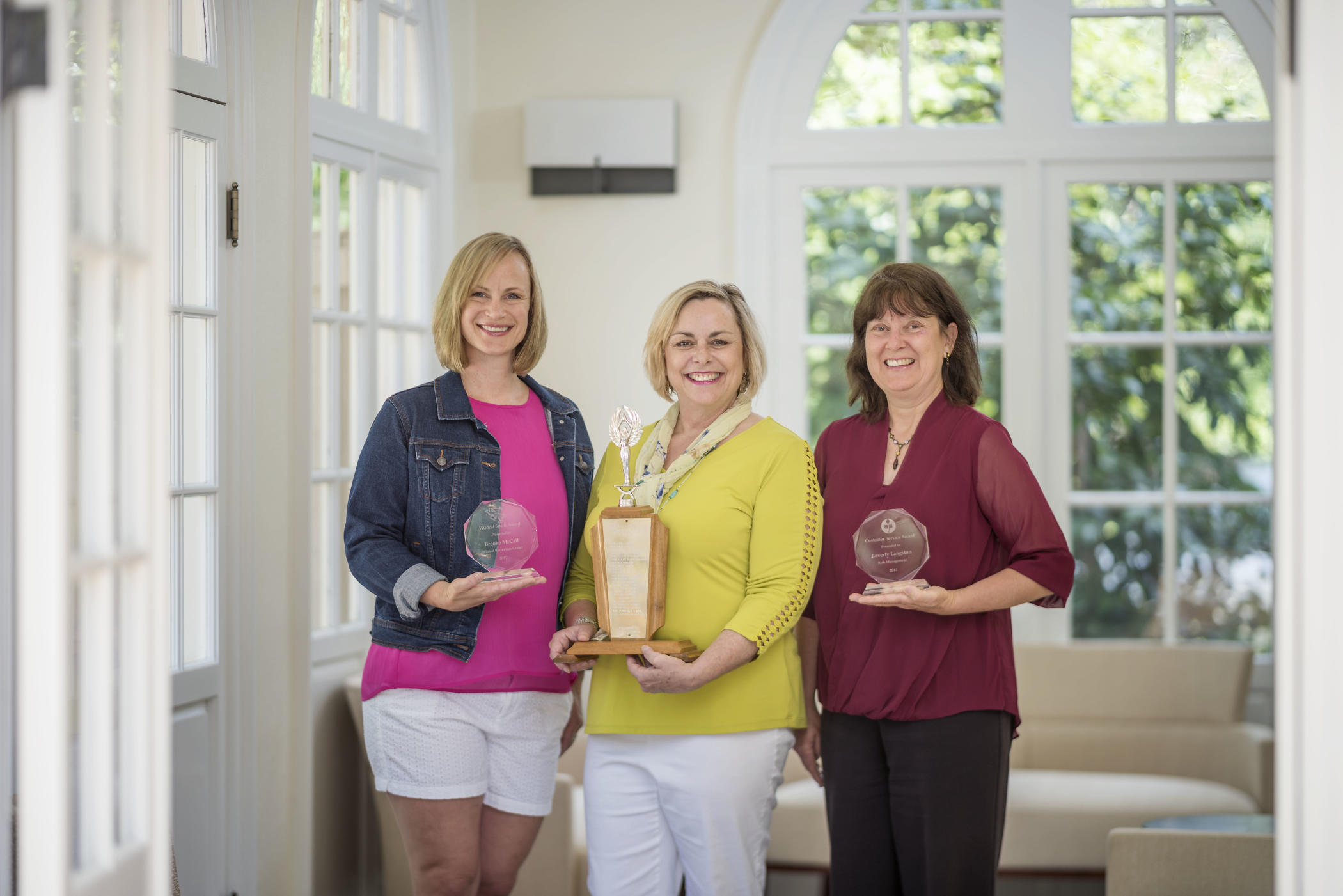 (Left to right) Brooke McCall, Kathleen Moroney, and Bev Langston pose with their awards.