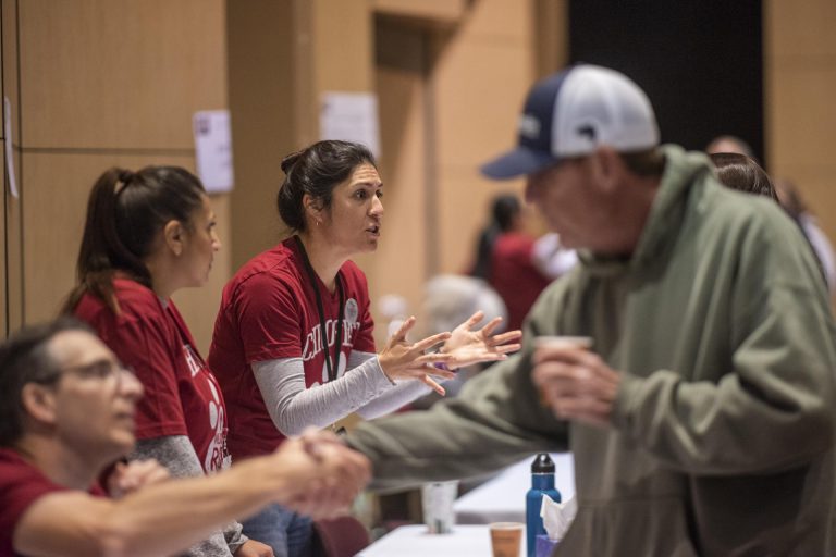 Chico State employees help answer questions of their colleagues during a Camp Fire resource fair.