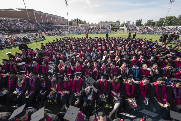 Hundreds of Chico State graduates sit and wait as Commencement ceremonies prepare to get underway.