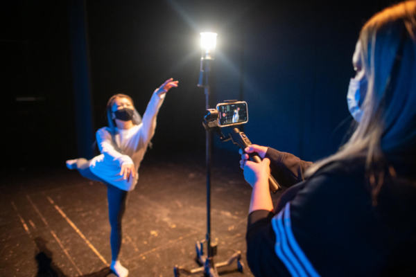 Natsumi Kawamura performs a dance routine as Megan Glynn Zollinger films on an iPhone.