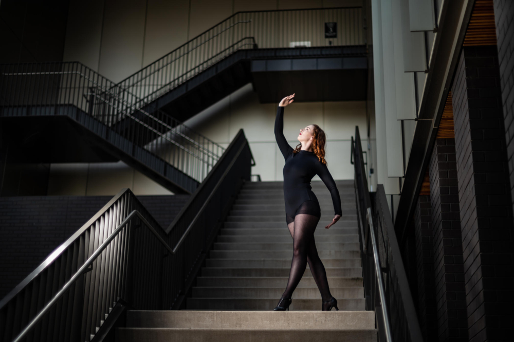 Emily Beets dances on the stairs of ARTS.