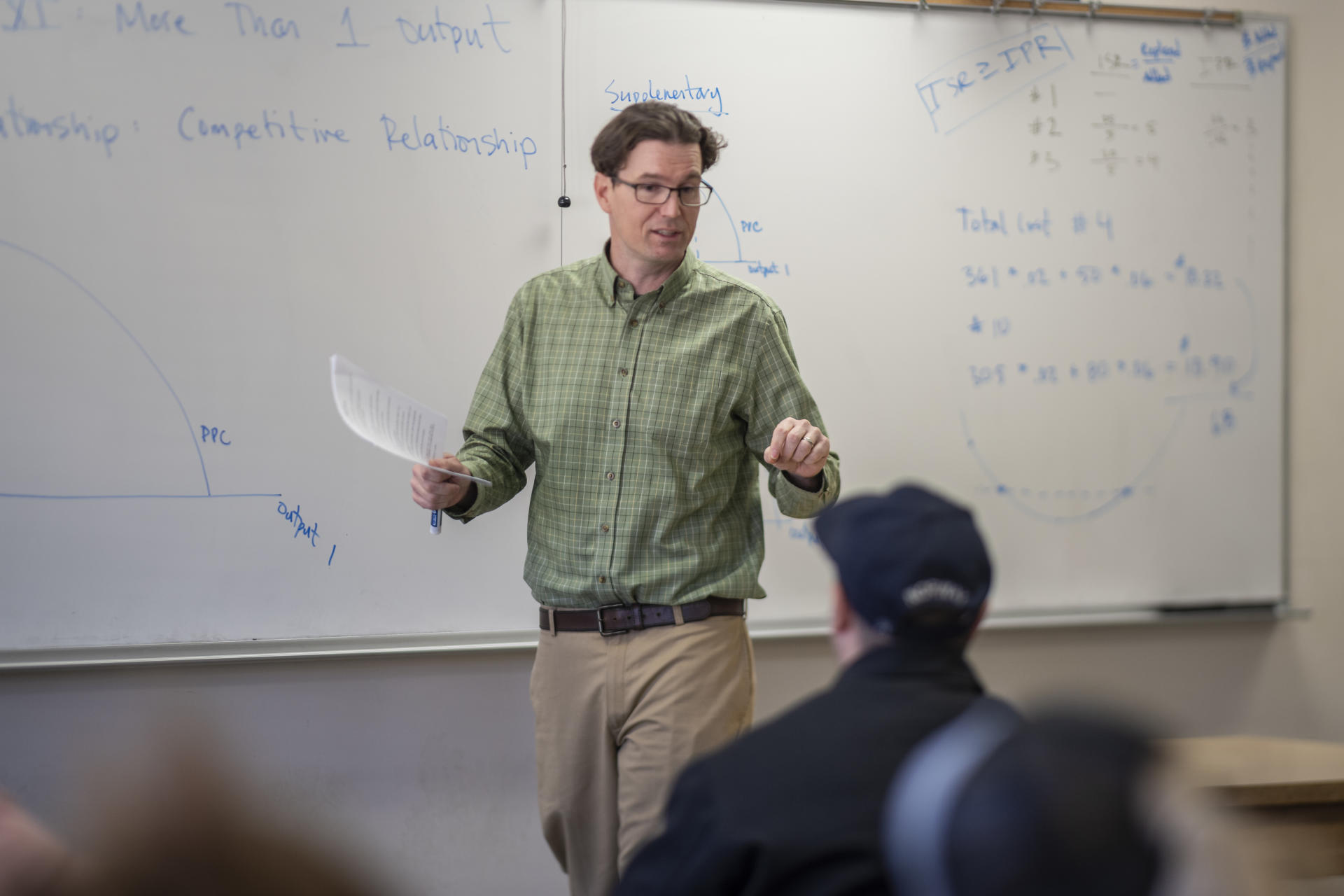 Professor Eric Houk teaches students in his class.