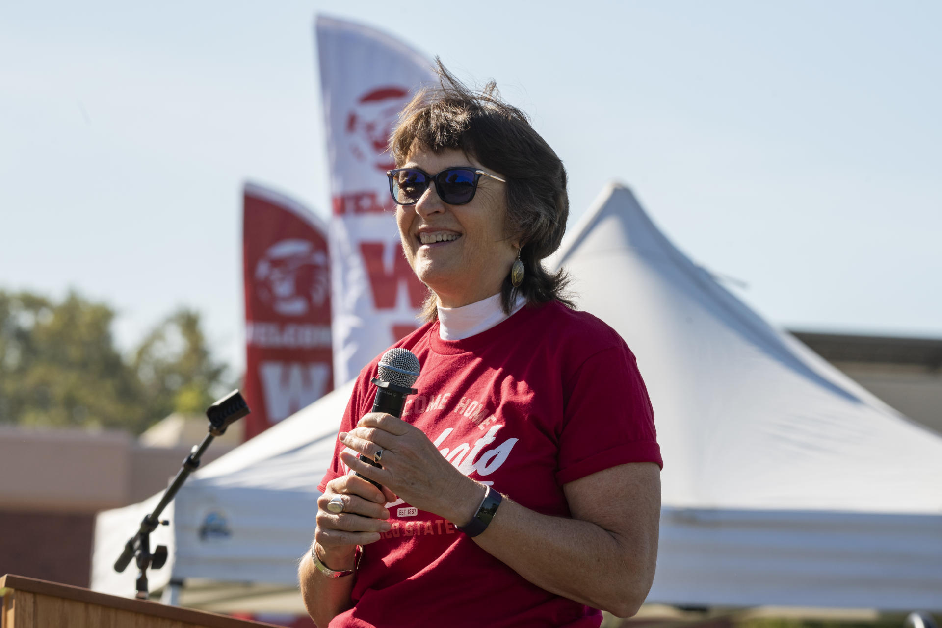 President Gayle Hutchinson smiles to a crowd as she addresses incoming freshmen to Chico State.