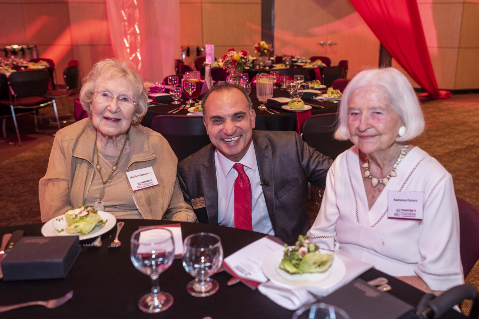 Marilyn Warrens sits with Ahmad Boura and another donor at the University's Campaign launch event.