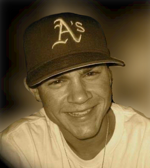 Portrait of Andrew Mora in an A's baseball cap