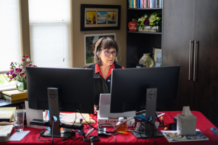 President Gayle Hutchinson sits in her home office, as she works from home like much of the rest of the University employees.