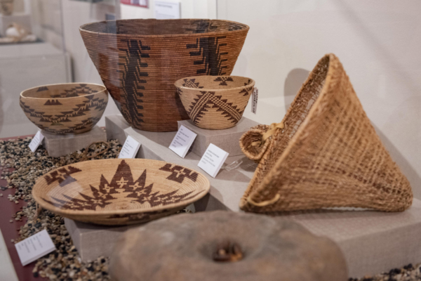 A collection of baskets from four generations of Mountain Maidu Weavers of the Meadows-Baker Family sits in the Valene L. Smith Museum.