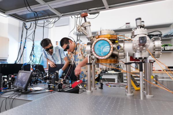 Farhan Rehman and Esteban Teran adjust the lasers that work to cool the atoms.