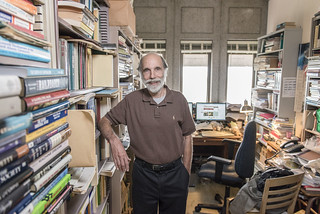 Michael Perelman poses for a portrait in his on-campus office.