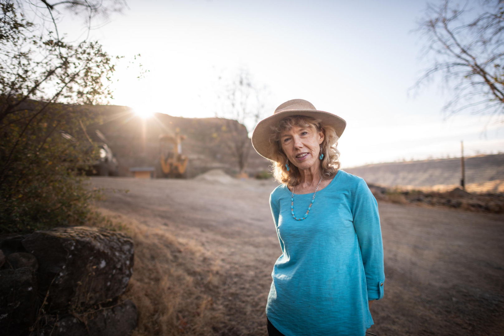 Cindy Wolff poses for a portrait near the rebuild of her home.